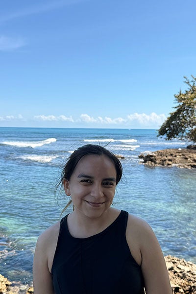A woman in front of the sea