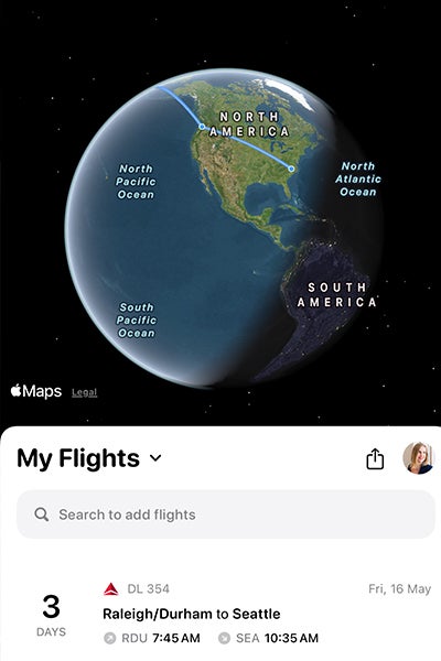 Image of a flight directory taken from a mobile phone showing a flight path superimposed on the globe.