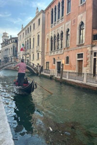 A gondola with a boat-man in Venice.
